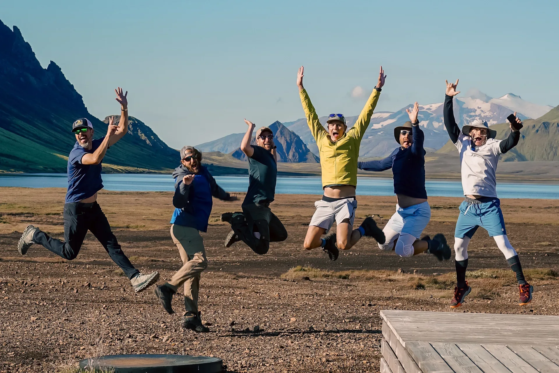 Happy group of hikers outside Alftavatn Hut in Iceland with Norse Adventures tour